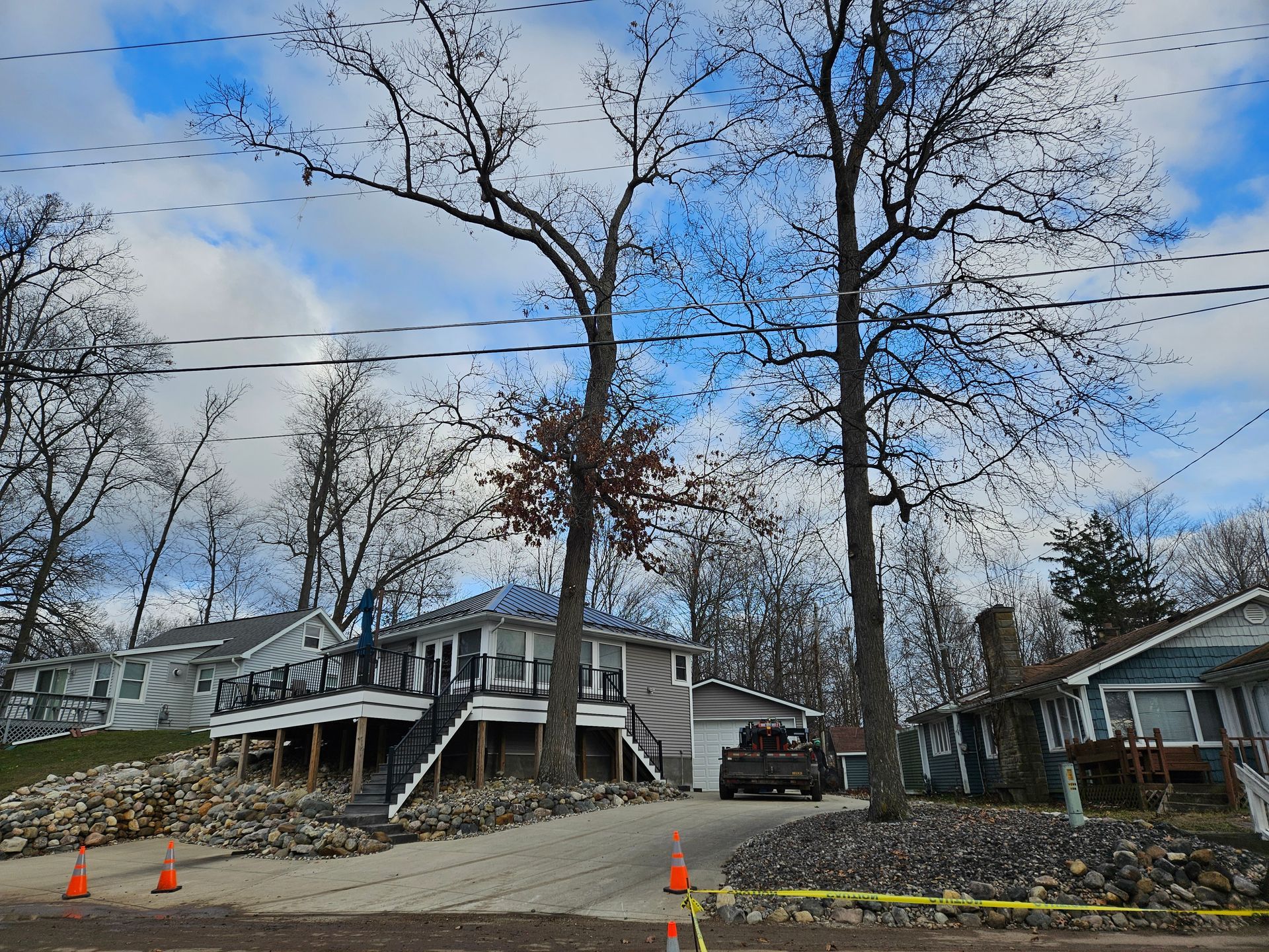 A house with a car parked in front of it