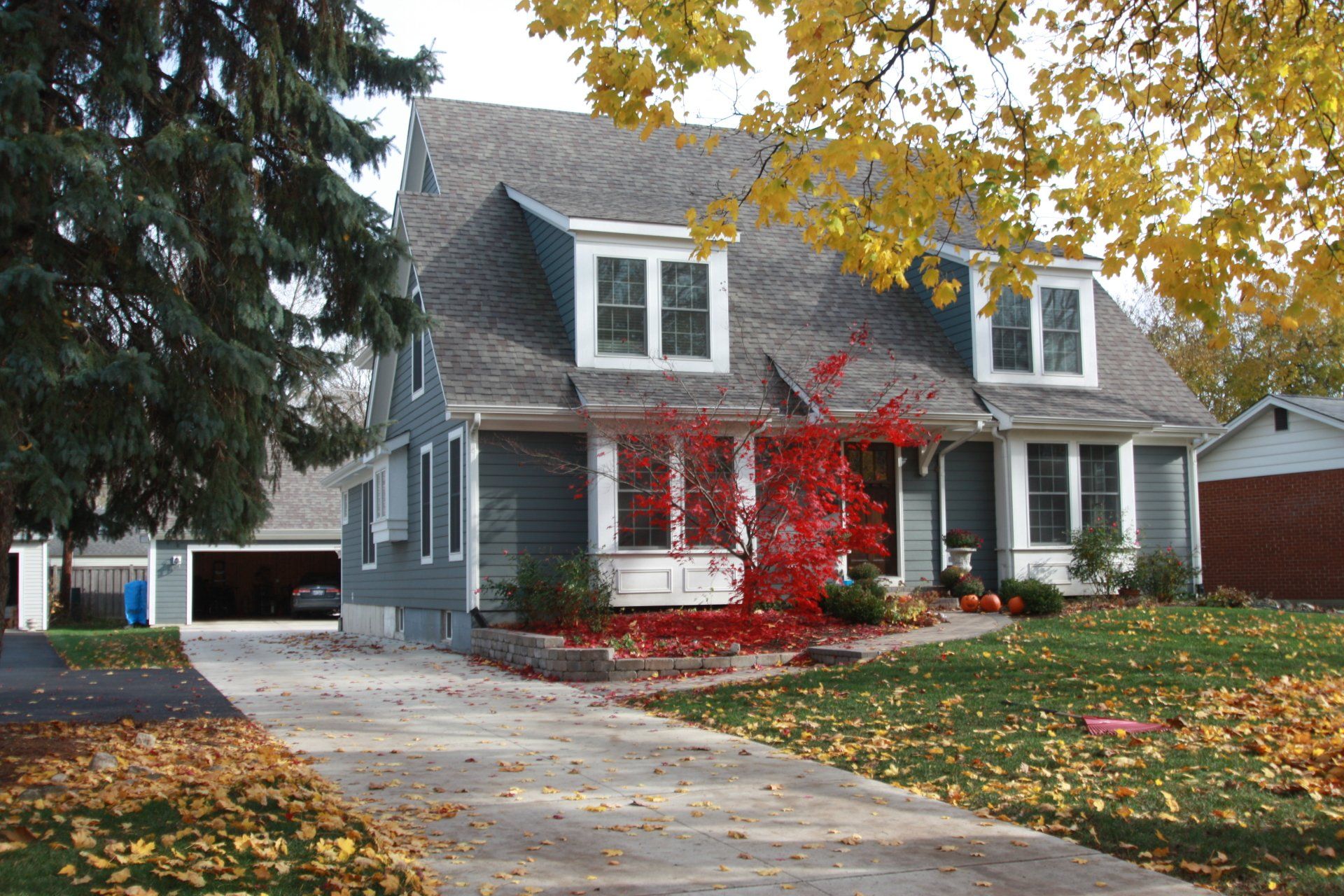 A large house with a driveway leading to it