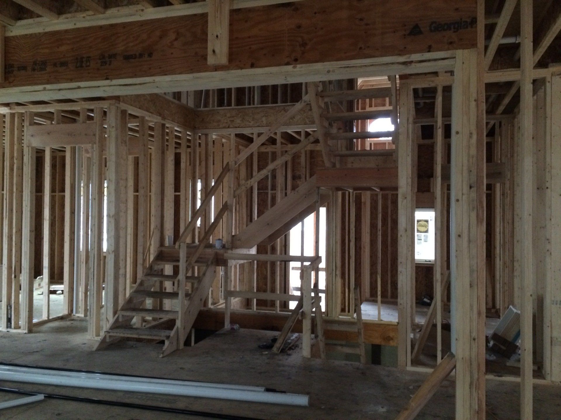 A staircase is being built in a house under construction