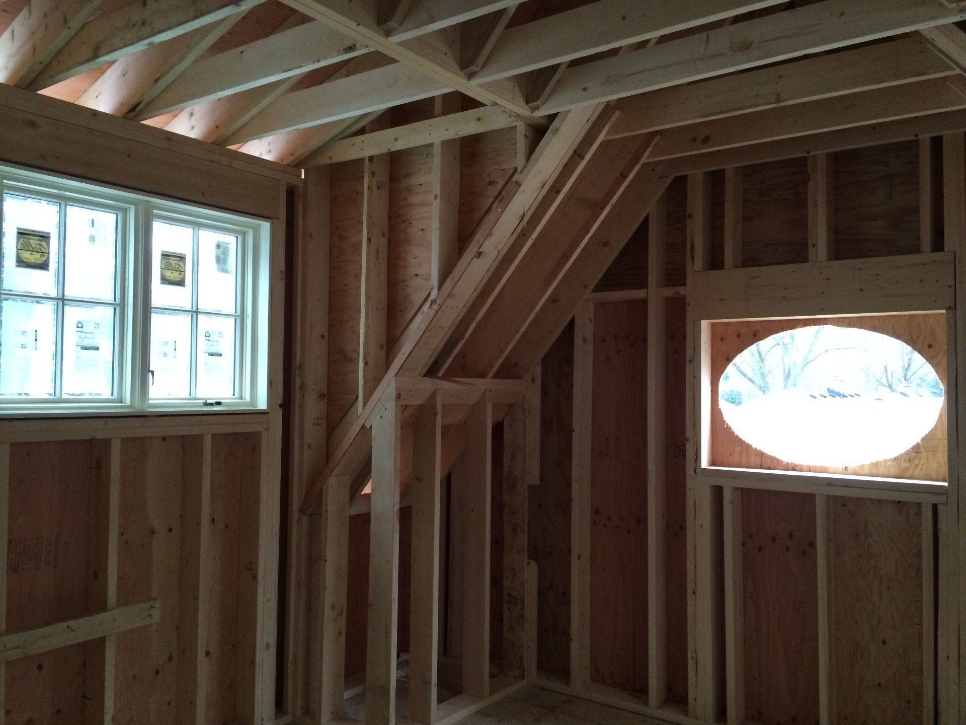 A room with a staircase and a window in it