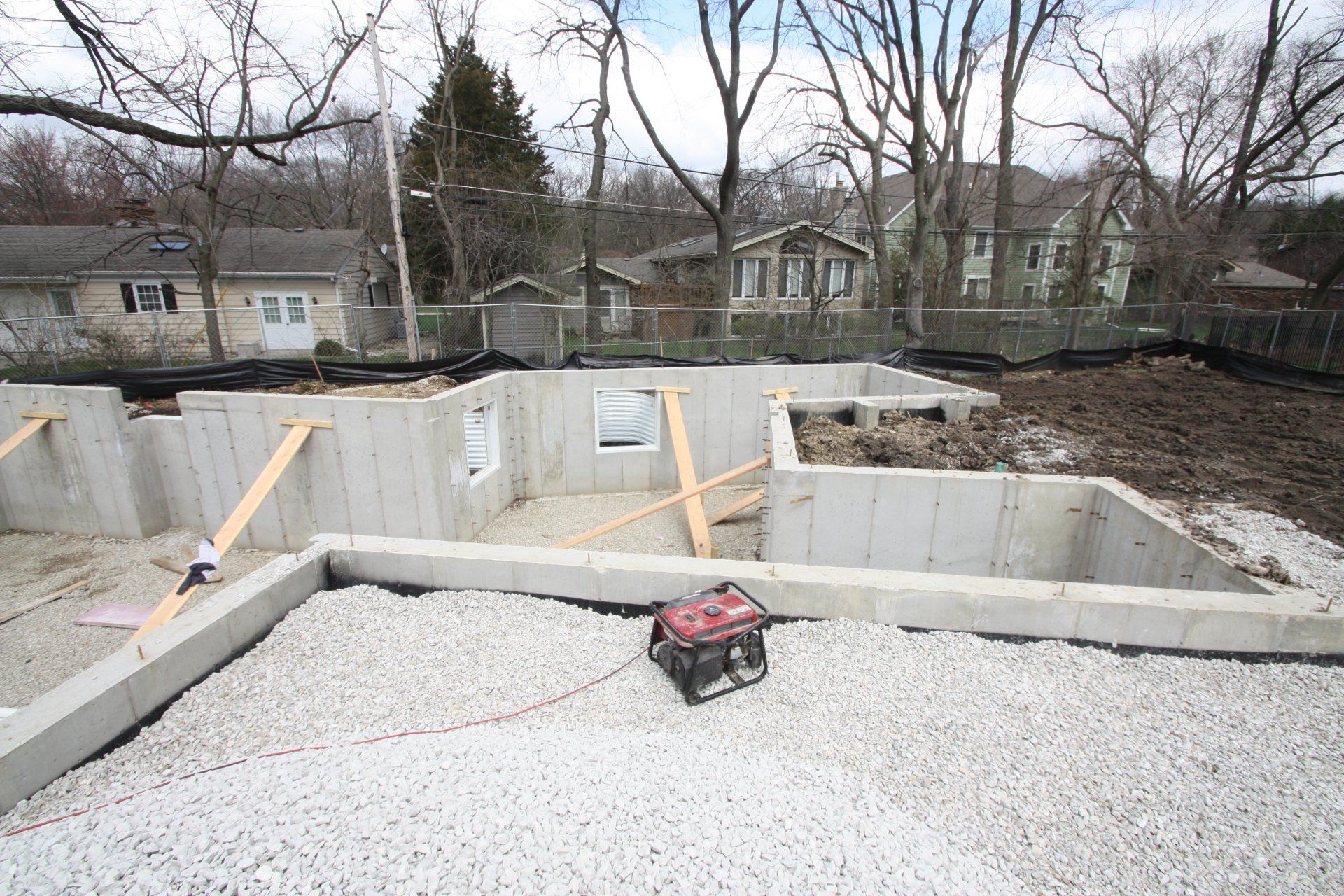 A concrete foundation is being built in a residential area