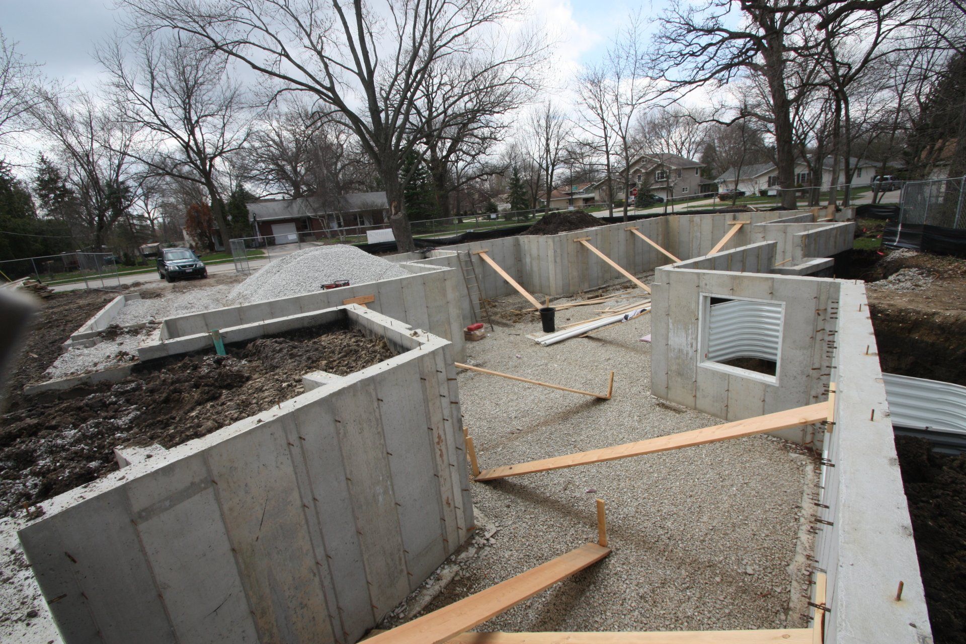 A construction site with concrete walls and wooden steps