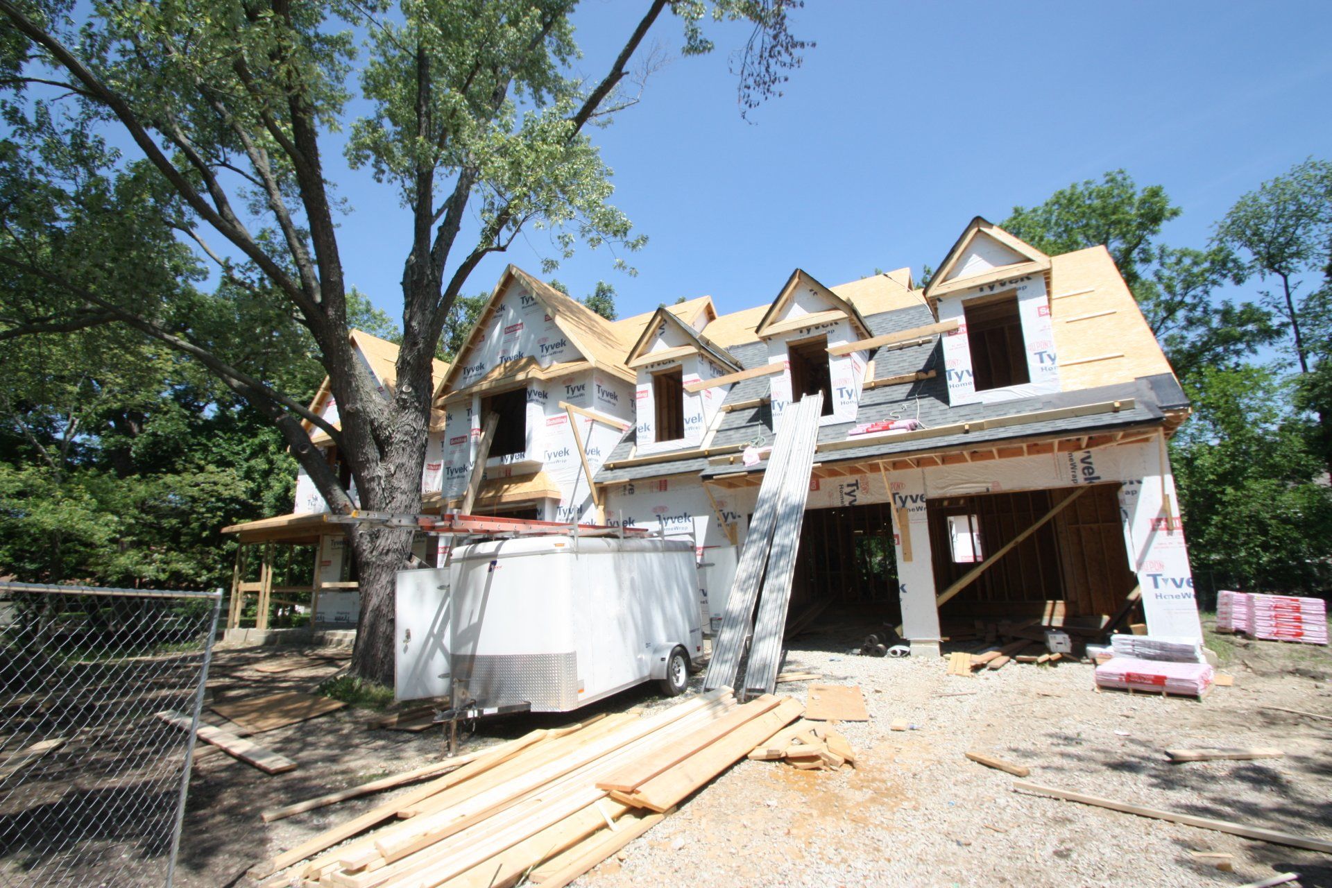 A house that is being built with a ladder in front of it