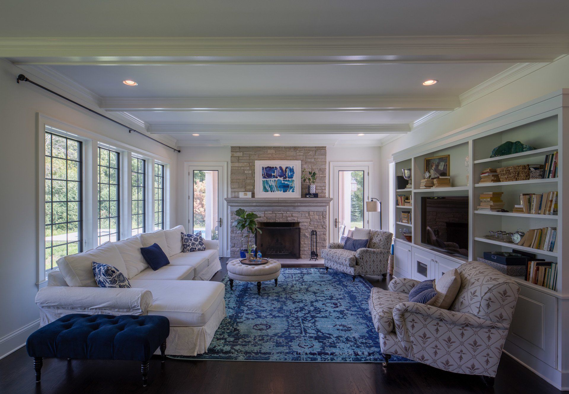 A living room filled with furniture and a fireplace.