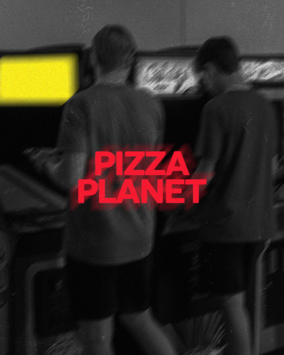 Man in camo pants sits, crowd with raised hands below 