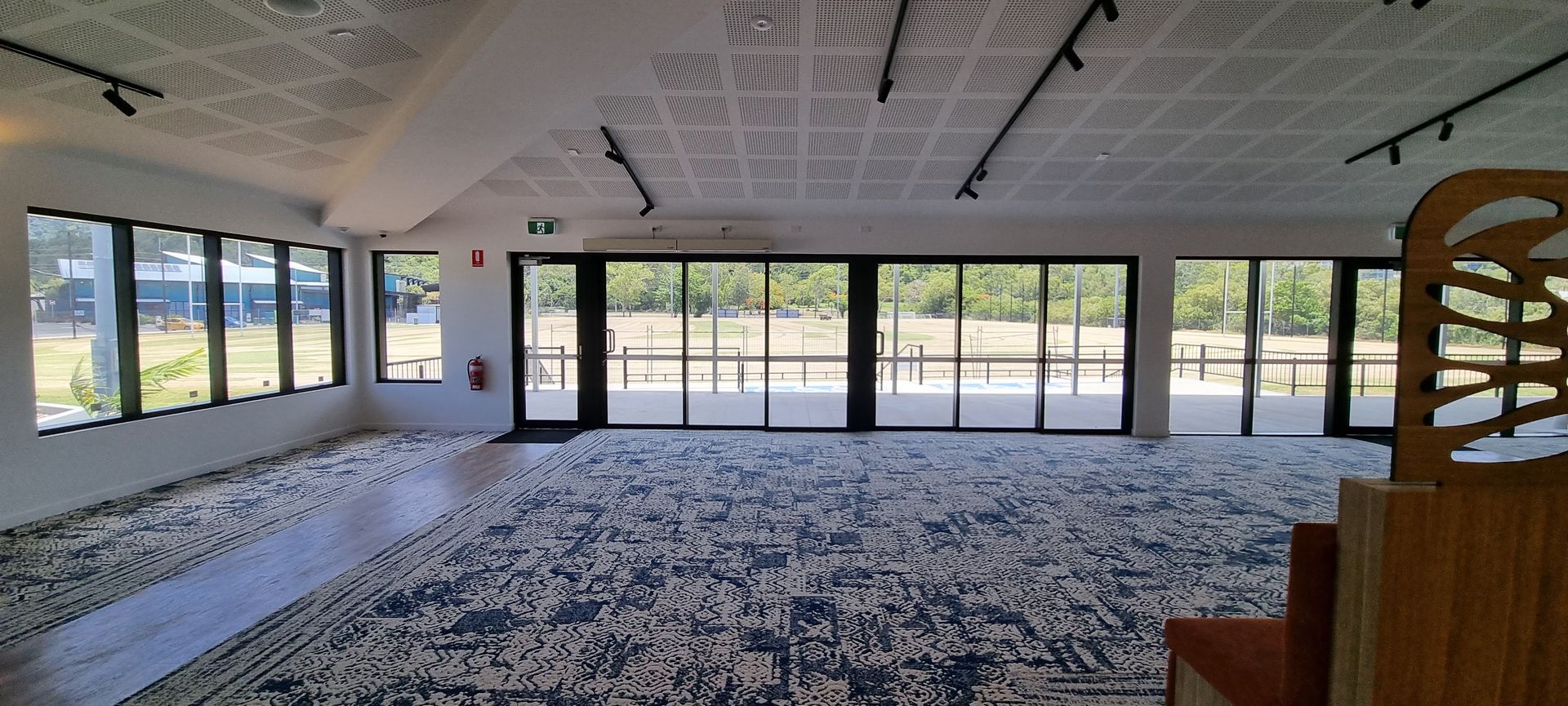 A Person Wearing Blue Gloves is Cleaning a Bed — Kristal Kleen Services in Jubilee Pocket, QLD