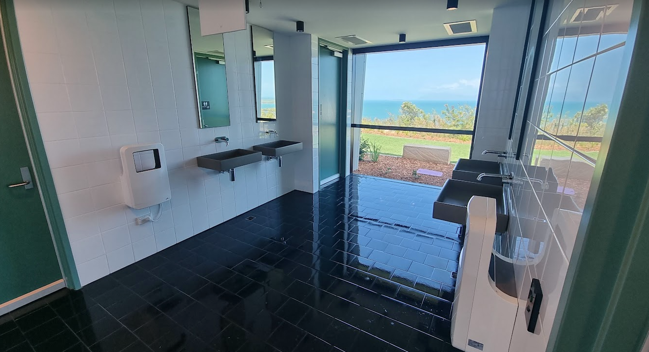 Clean bathroom with black tiles — Kristal Kleen Services in Jubilee Pocket, QLD