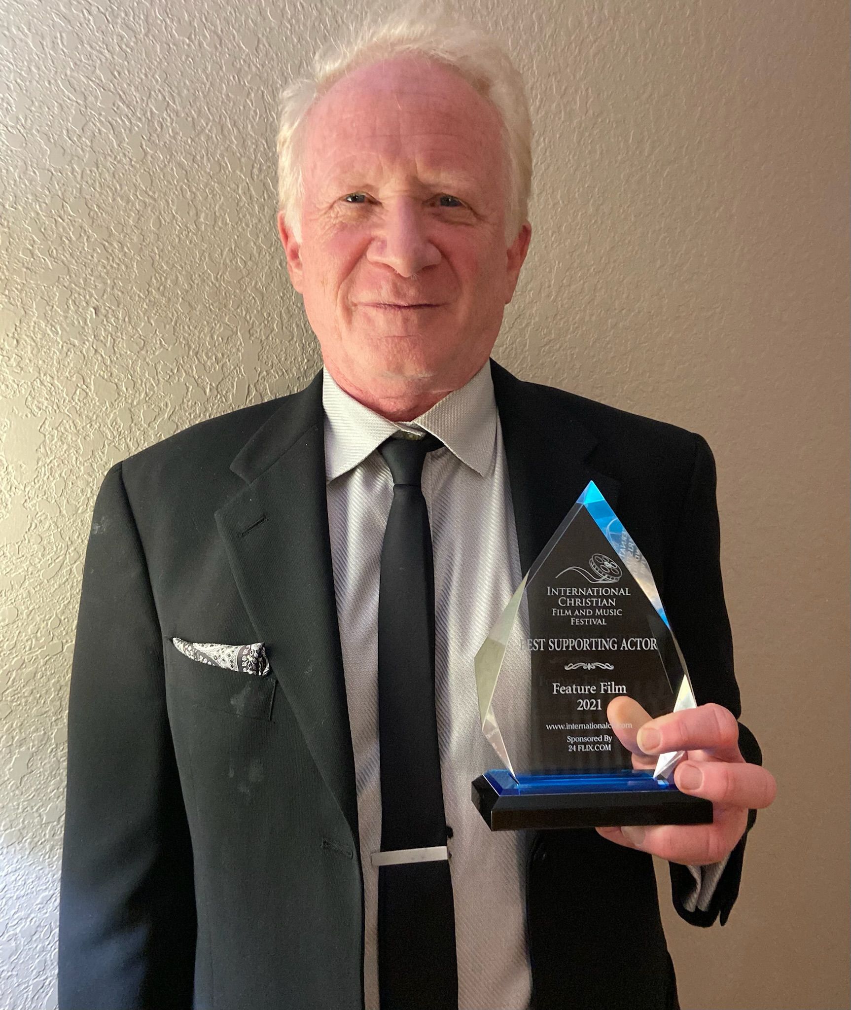 Don Most holding an Acting Award.