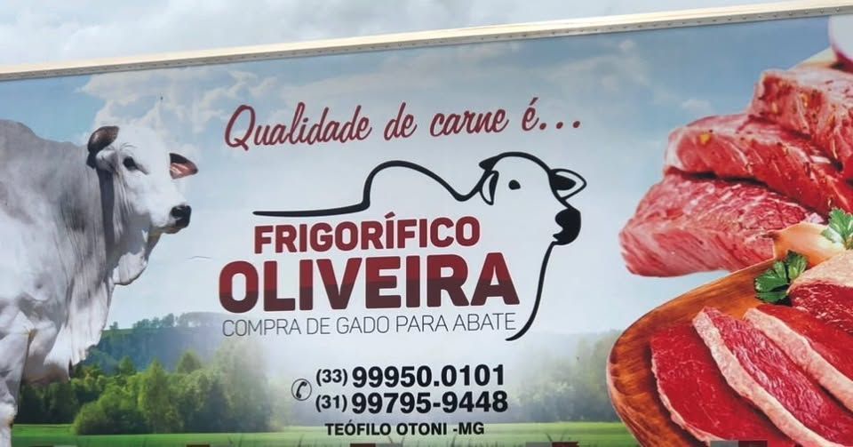 Um anúncio do frigorífico oliveira mostra uma vaca e uma pilha de carne