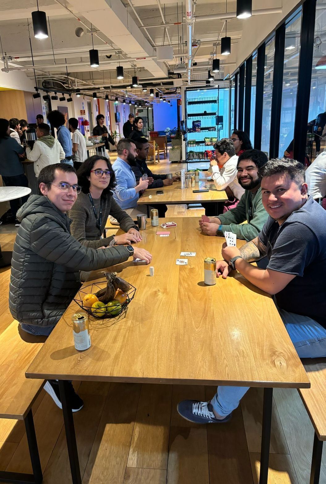 Coupa employees enjoying a card game event at the Bogota office