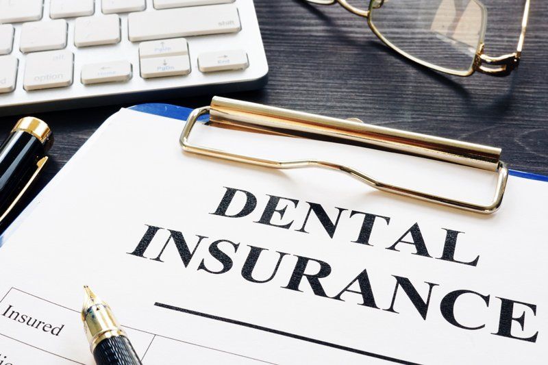 Dental Insurance Form and Pen — Albuquerque, NM — Comfortable Dentistry 4U