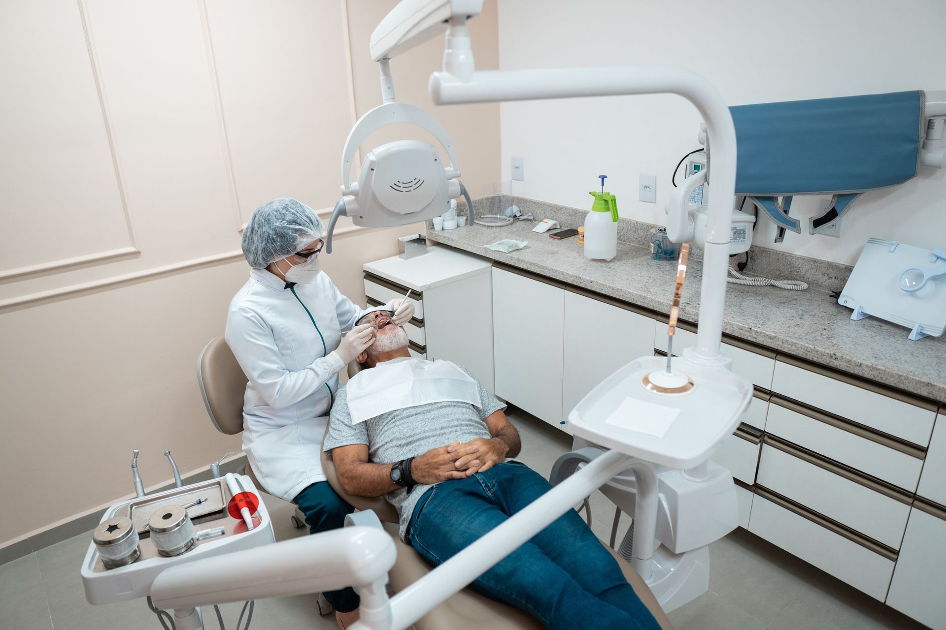 A man in a dental chair with a woman beside him at Comfortable Dentistry 4U, offering general dental