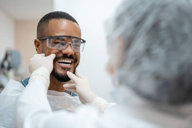 Patient enjoying a comfortable dental exam in a friendly office environment.