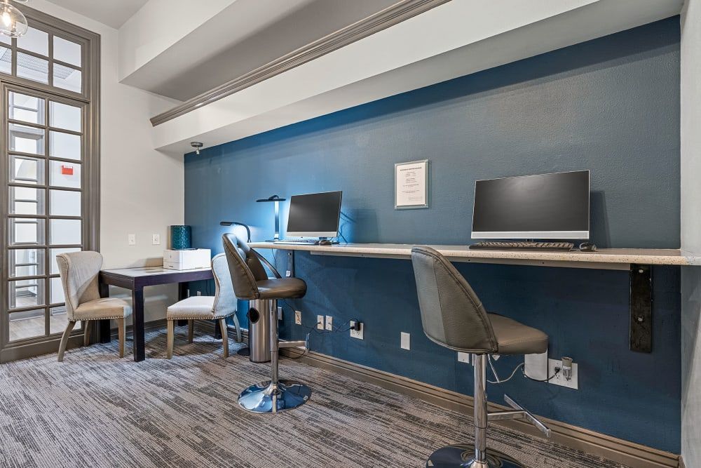 Business center with two desks and two chairs with computers on them at Marquis at Town Centre in Broomfield, CO.