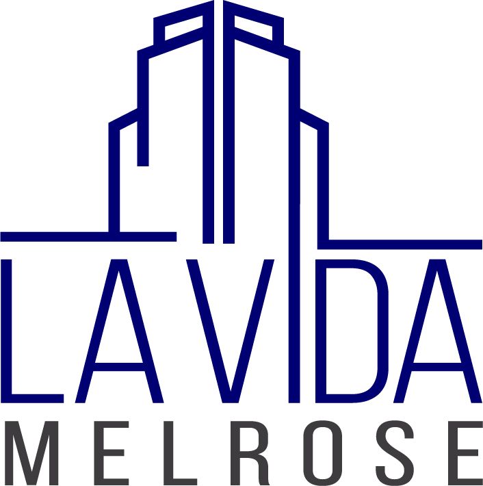 Logo for La Vida Melrose, with a dark blue abstract skyscraper and text below.