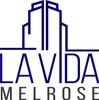 Logo for La Vida Melrose, with a dark blue abstract skyscraper and text below.
