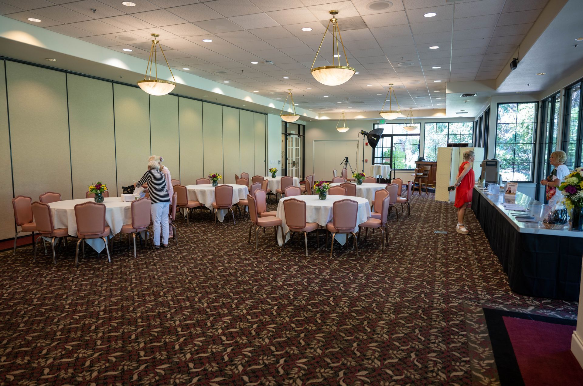 A large room with tables and chairs in it