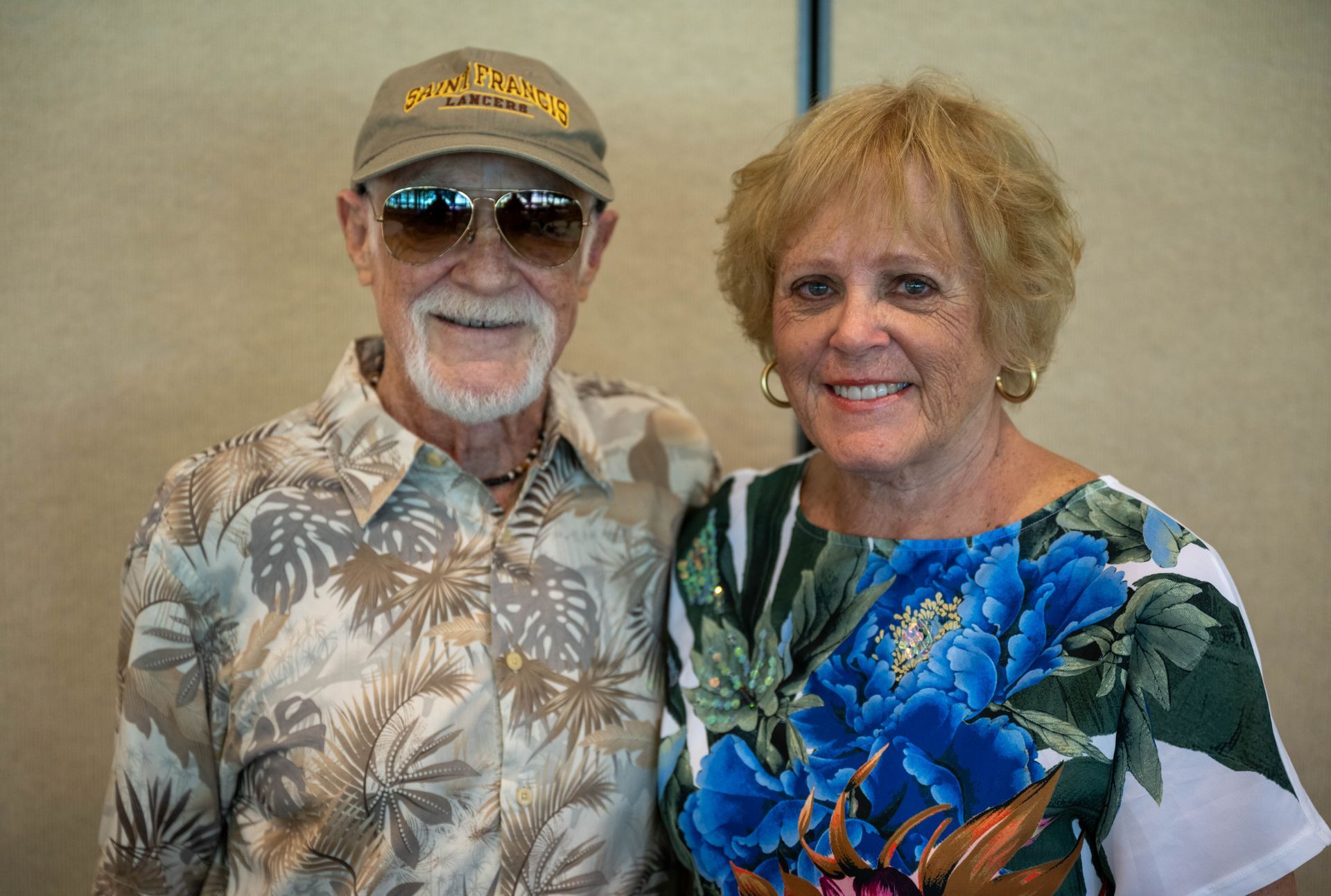 A man and a woman are posing for a picture together.