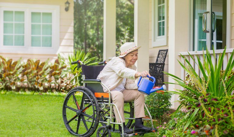 Elderly woman relax with gardening in backyard