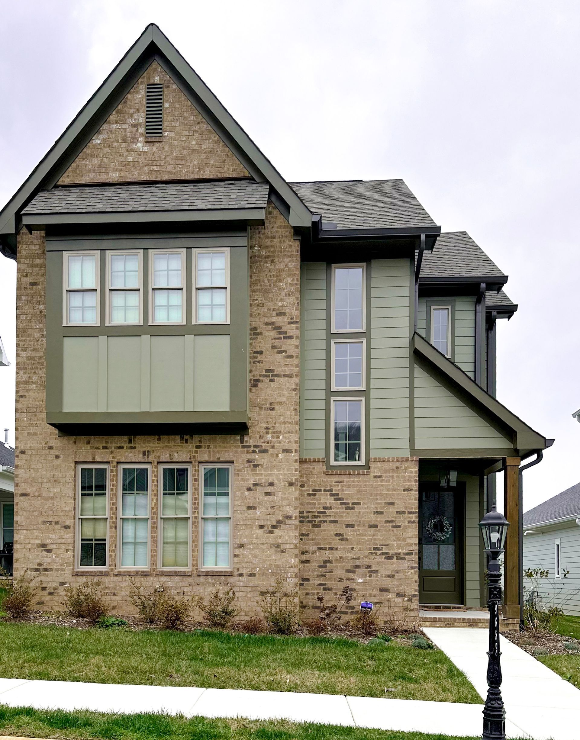 the front of a house with a wreath on the door