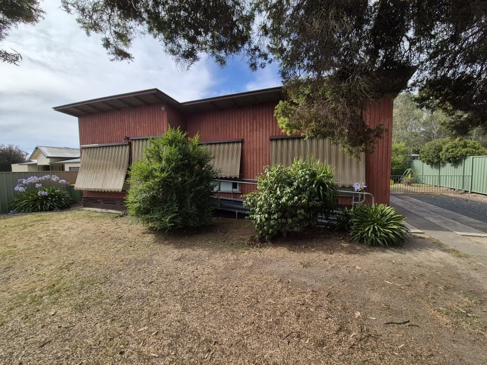 Red-Brown Building With Closed Window Blinds — The Roofer Troopers (NSW) in Howlong, NSW
