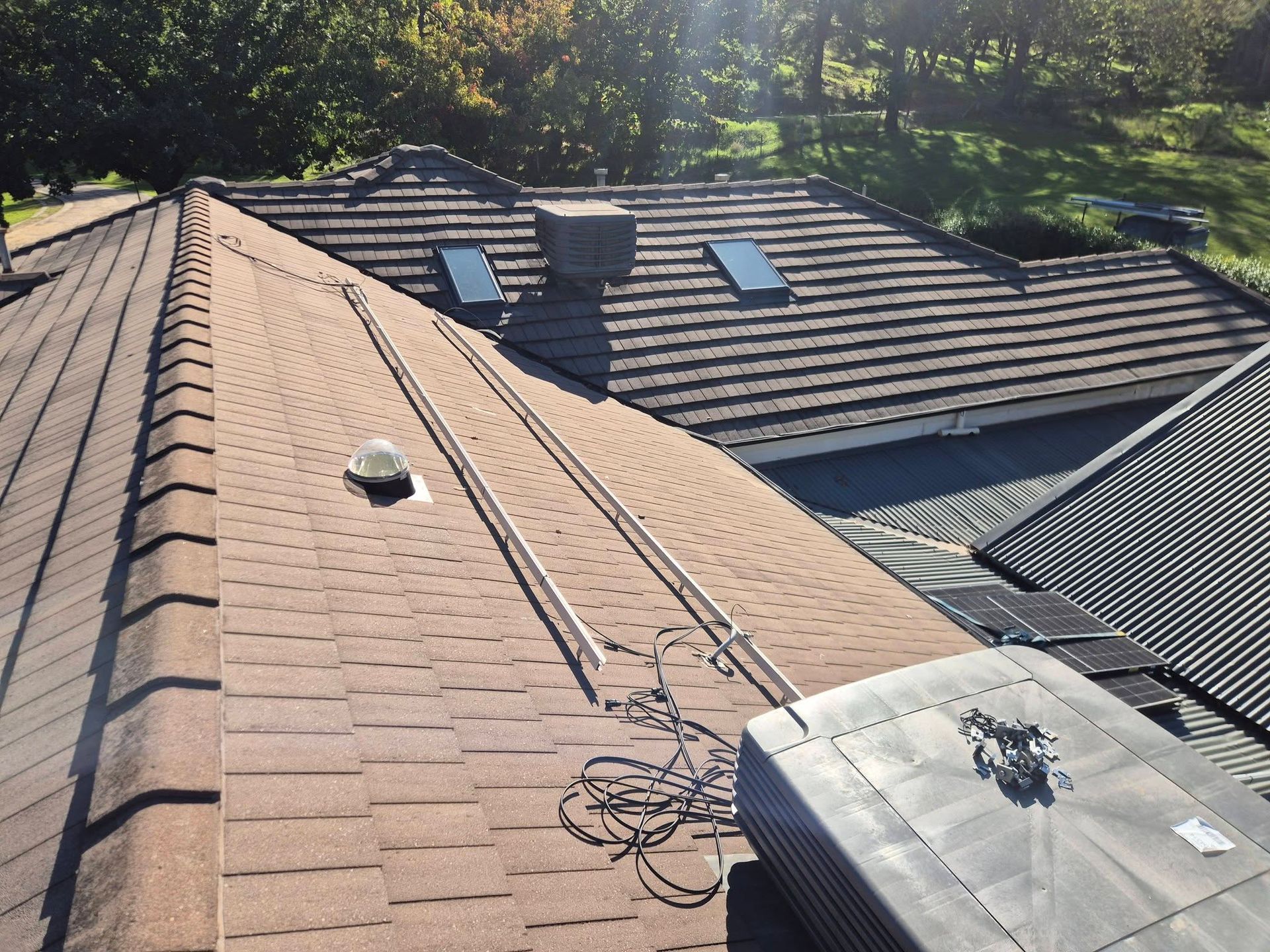 Roof With Asphalt Shingles, Skylights, and a Rooftop — The Roofer Troopers in Wodonga, VIC