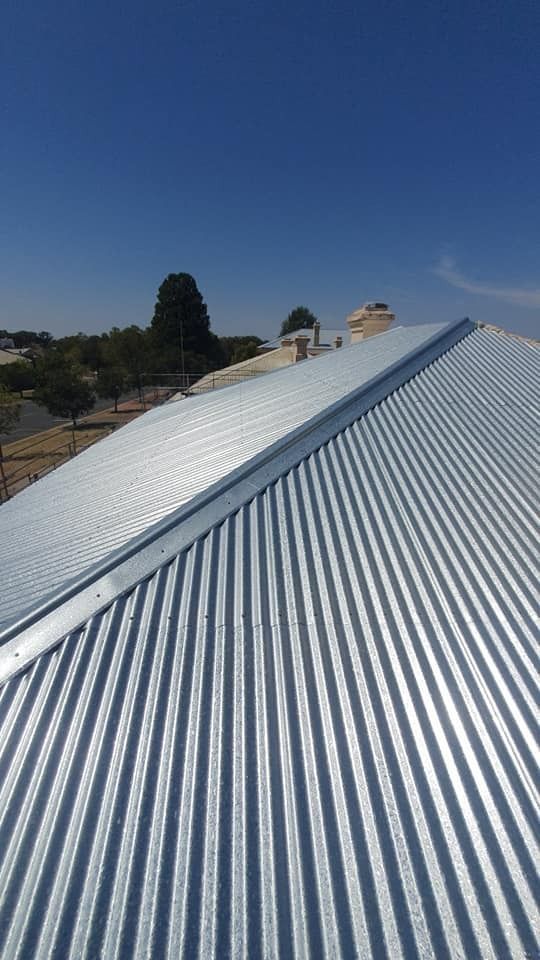 New Corrugated Metal Roof on a House With a Clear Blue Sky in the Background — The Roofer Troopers (NSW) in Howlong, NSW