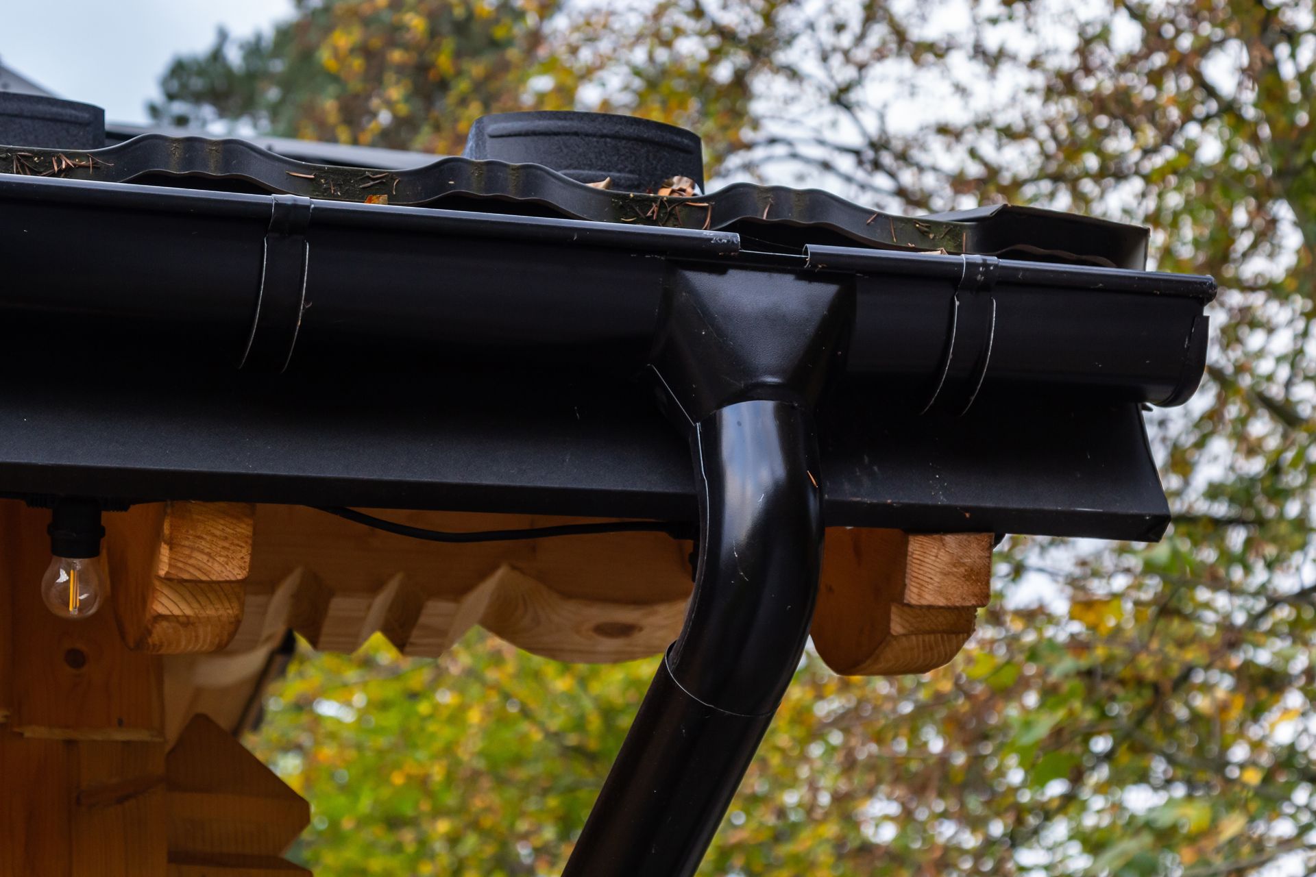 Close-up image of a black gutter