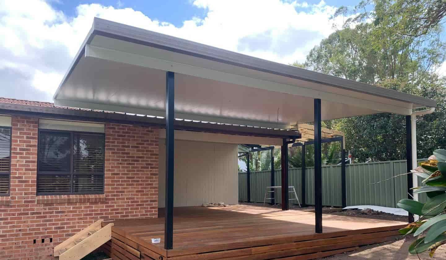 A House With A Wooden Deck And A Covered Patio — Caprice Home Additions In Wingham, NSW