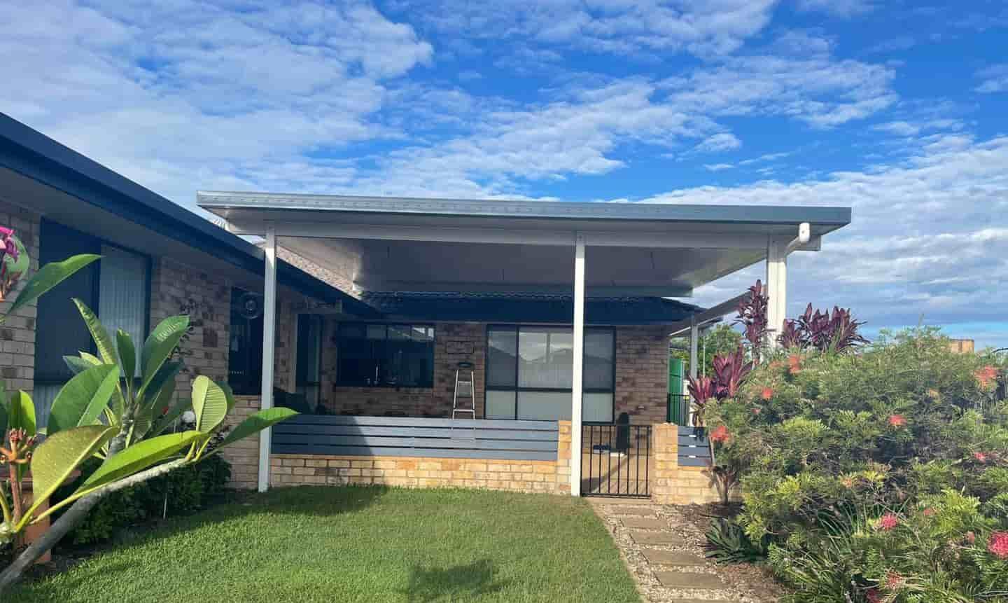 A House With A Covered Porch And A Walkway In Front Of It — Caprice Home Additions In Tuncurry, NSW
