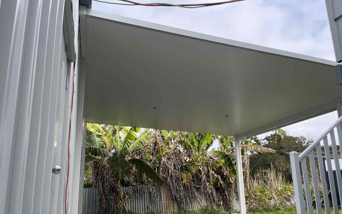 A White Carport With A Staircase Leading Up To It — Caprice Home Additions In Tuncurry, NSW