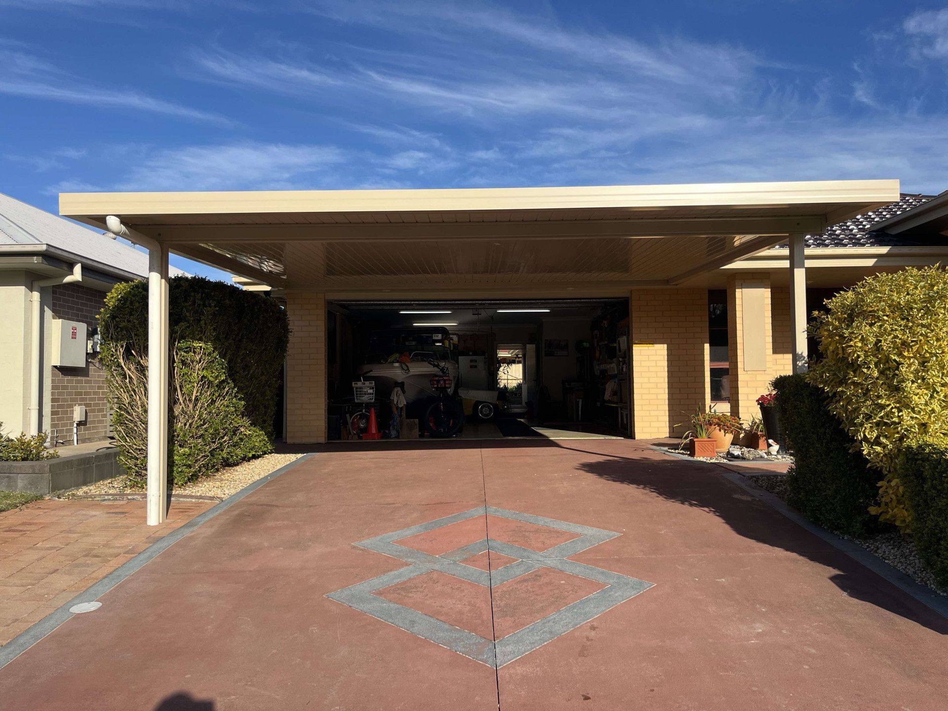 Carport With Driveway Leading to Garage — Caprice Home Additions In Taree, NSW