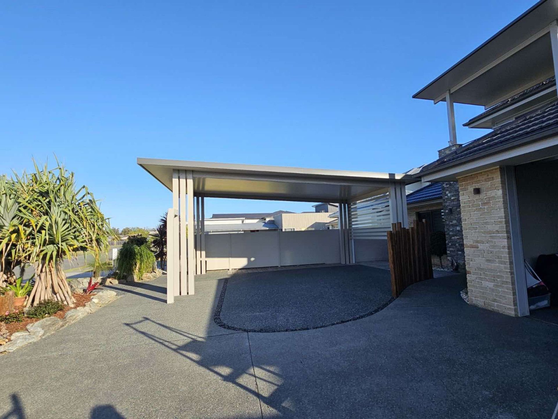 A Carport Is Sitting In Front Of A House  — Caprice Home Additions In Taree, NSW