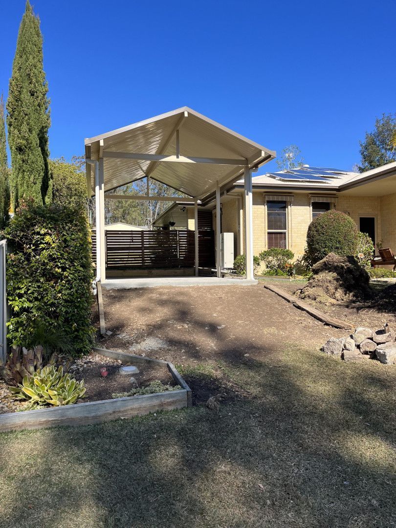 A House With a Carport in Front of It — Caprice Home Additions In Taree, NSW