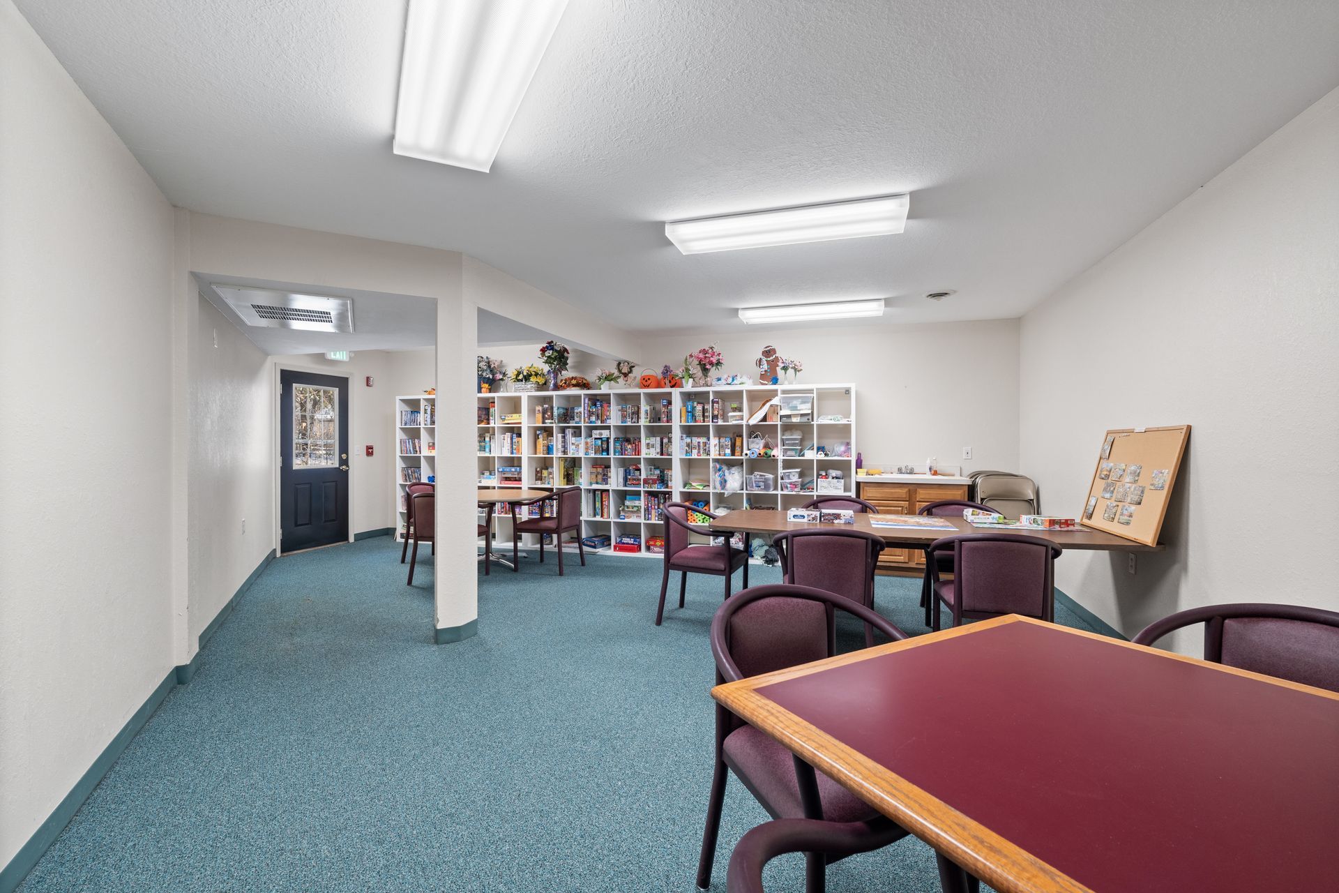 Photo of a craft room with a shelf in the background
