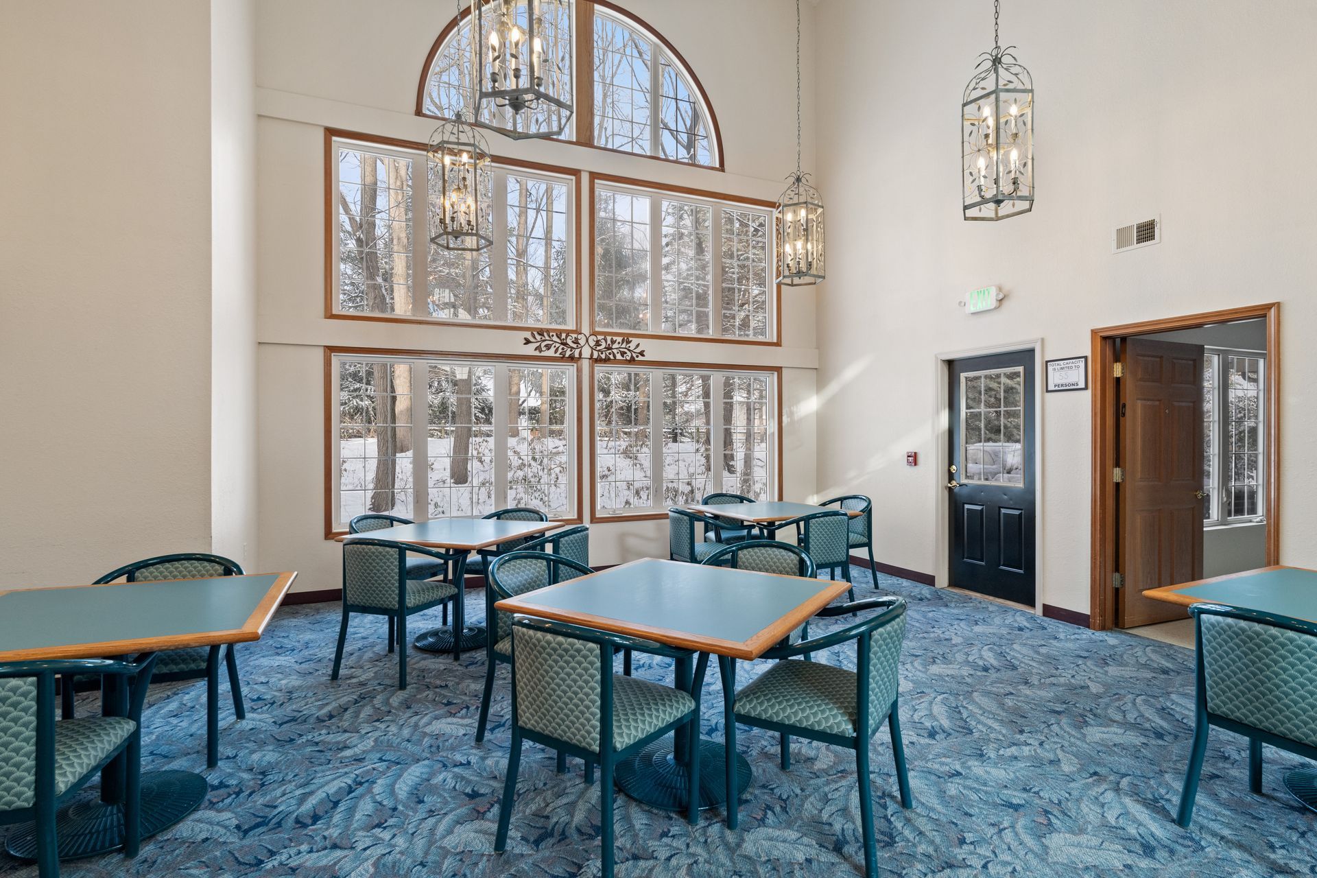 Photo of a part of the great room that has a set of 6 large windows, allowing for plenty of natural lighting