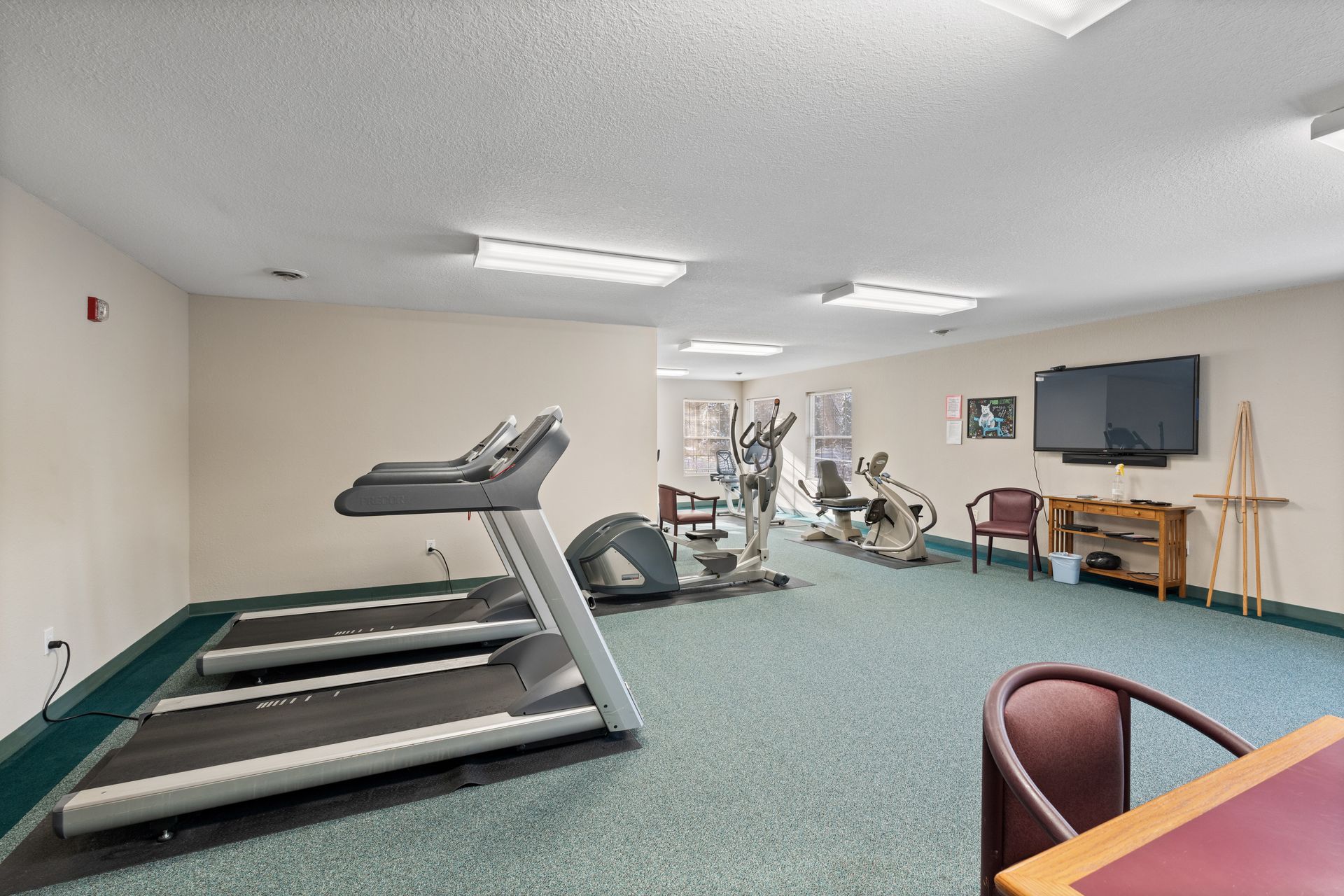 Photo of the gym with a desk in the front of the photo