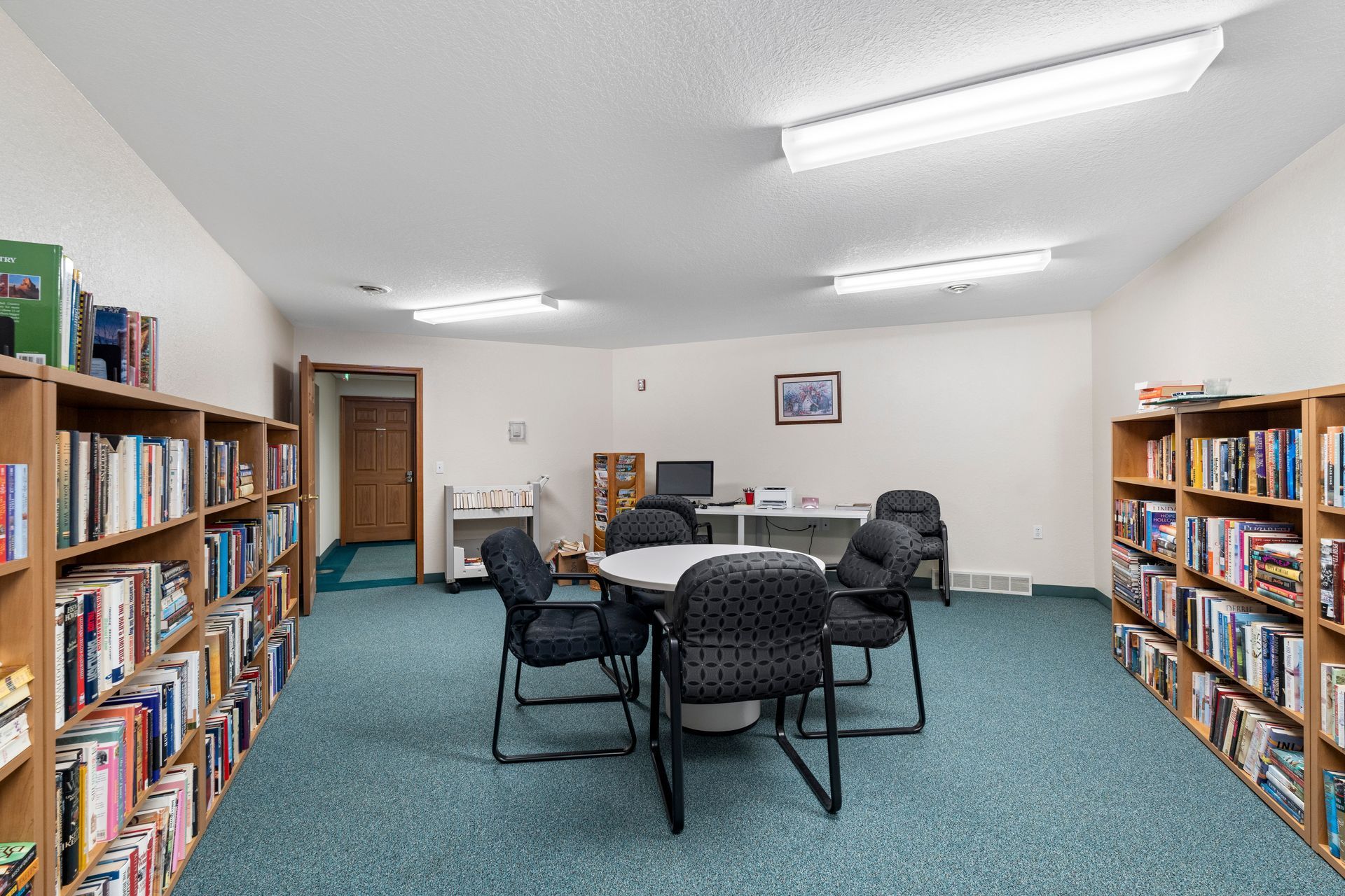 Photo of a library with a few places to sit