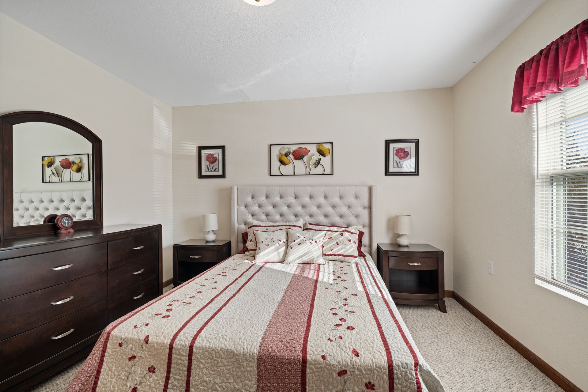 Photo of a bed in a bedroom with plenty of natural lighting
