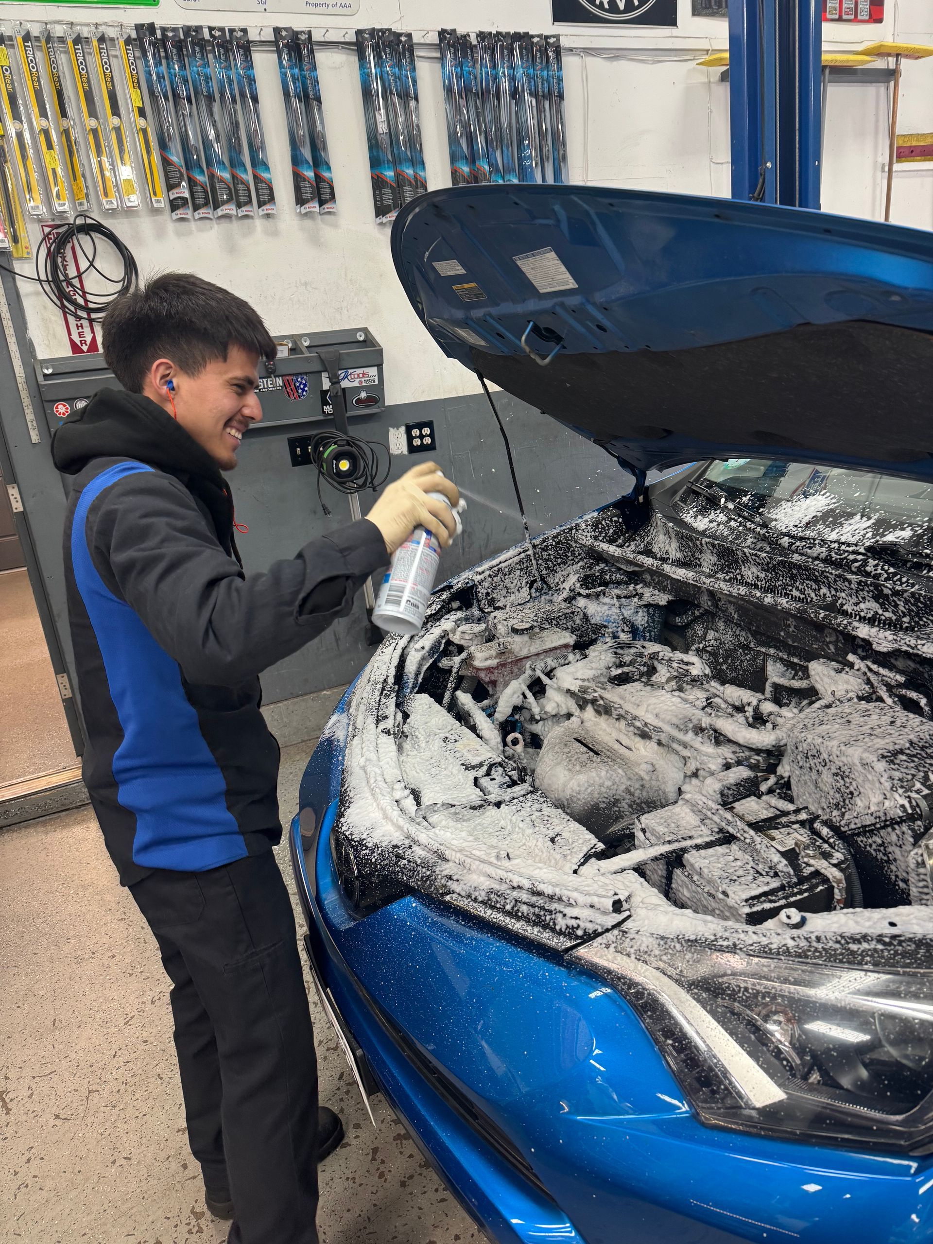 man working on car brake | Mike's Auto Repair