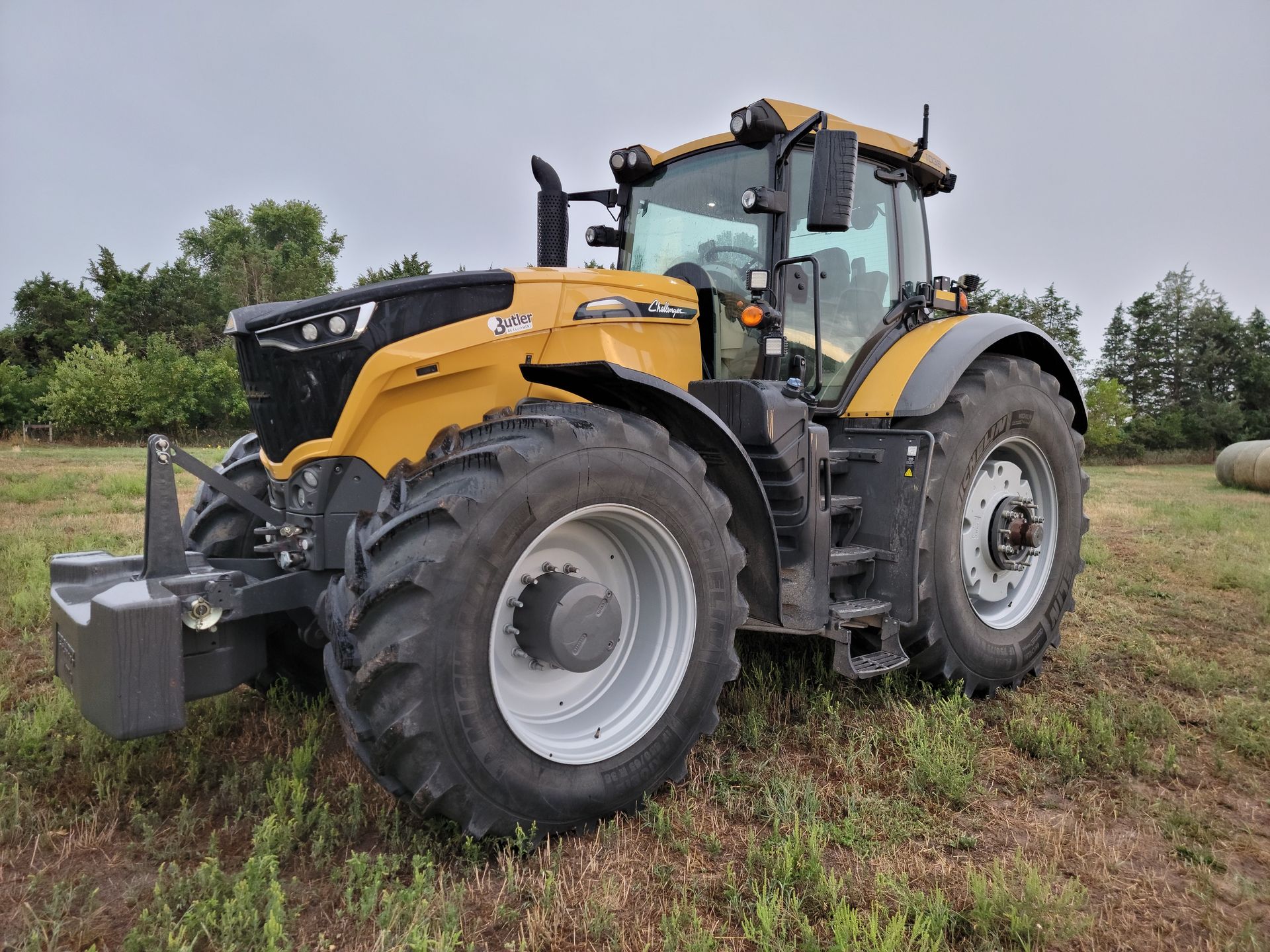 Yellow Challenger tractor in a field.