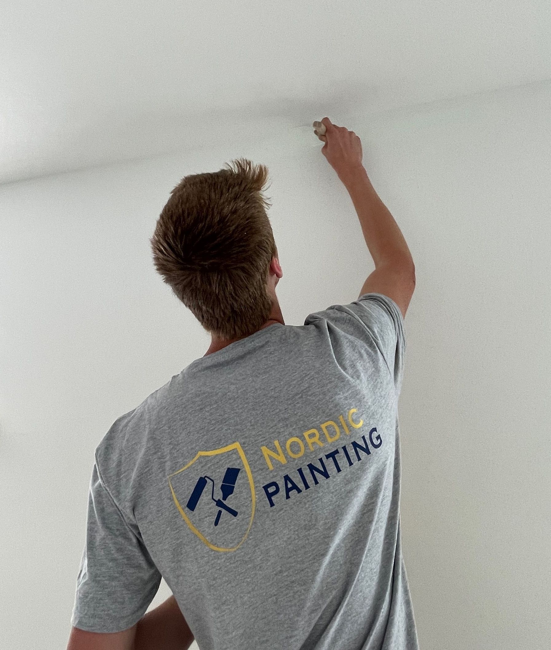 painter, painting the interior of a home in Reedsburg, Wisconsin