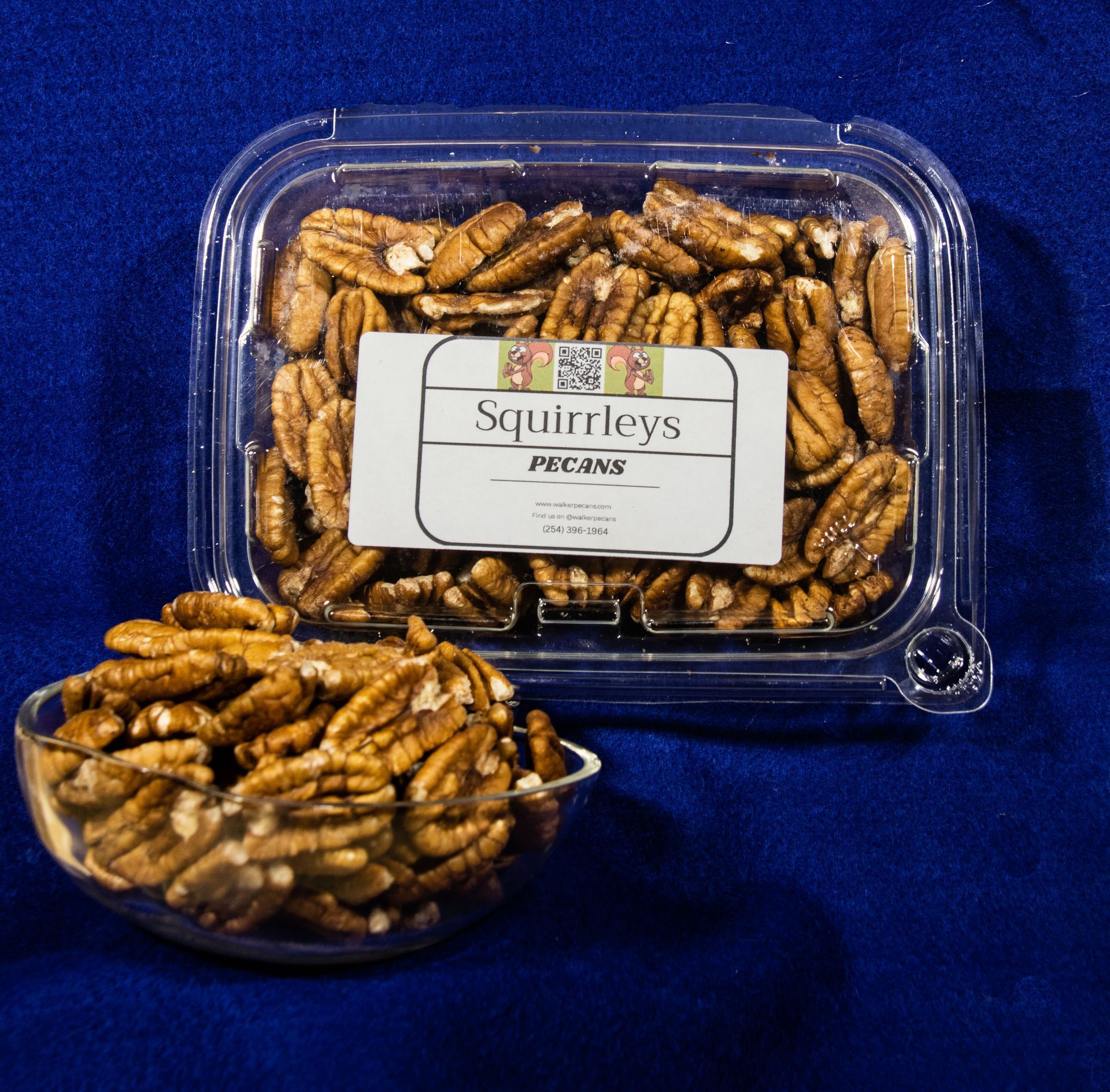 Clear plastic container and bowl filled with sugared pecans; label reads