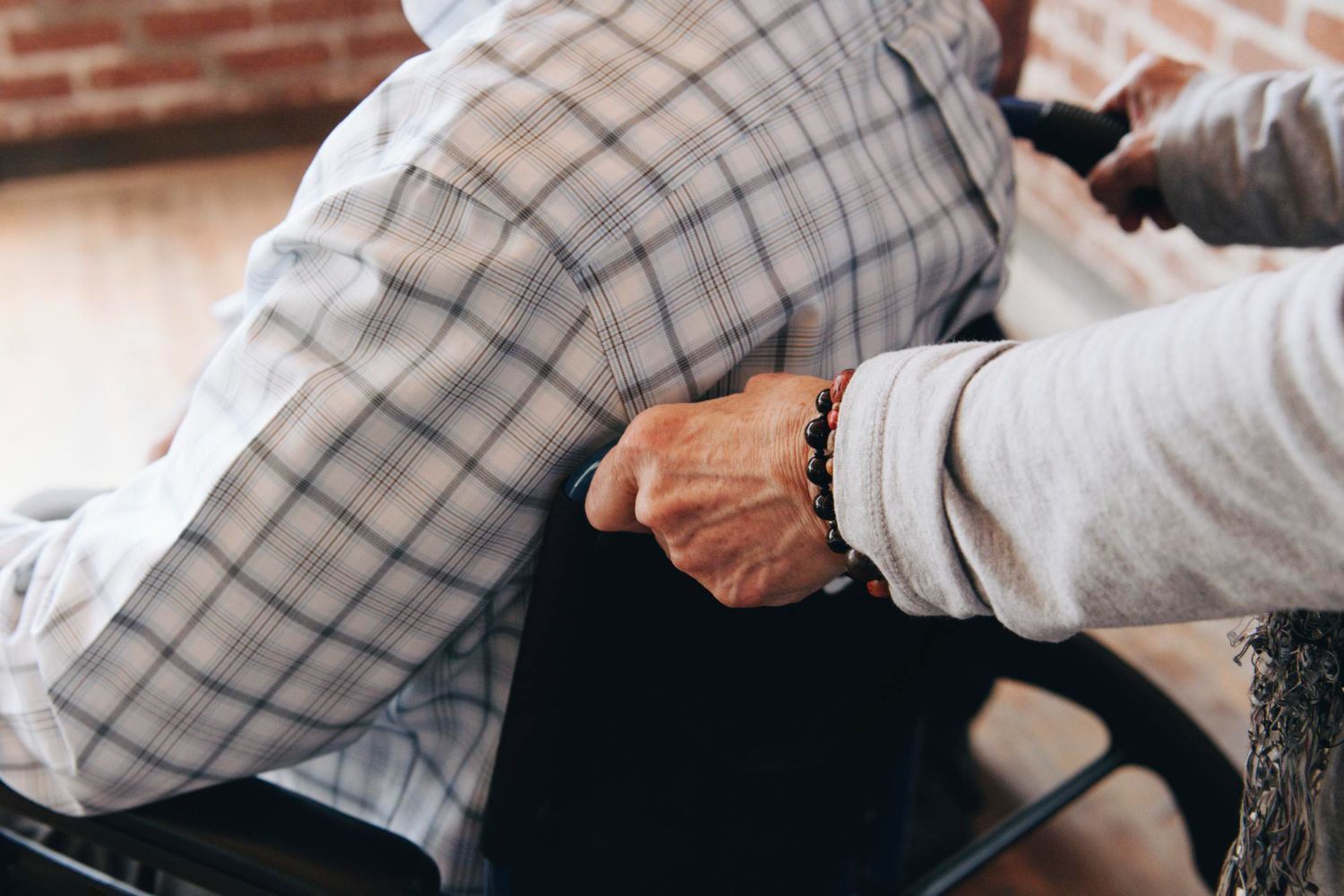 A man and woman are walking down a road with a child.