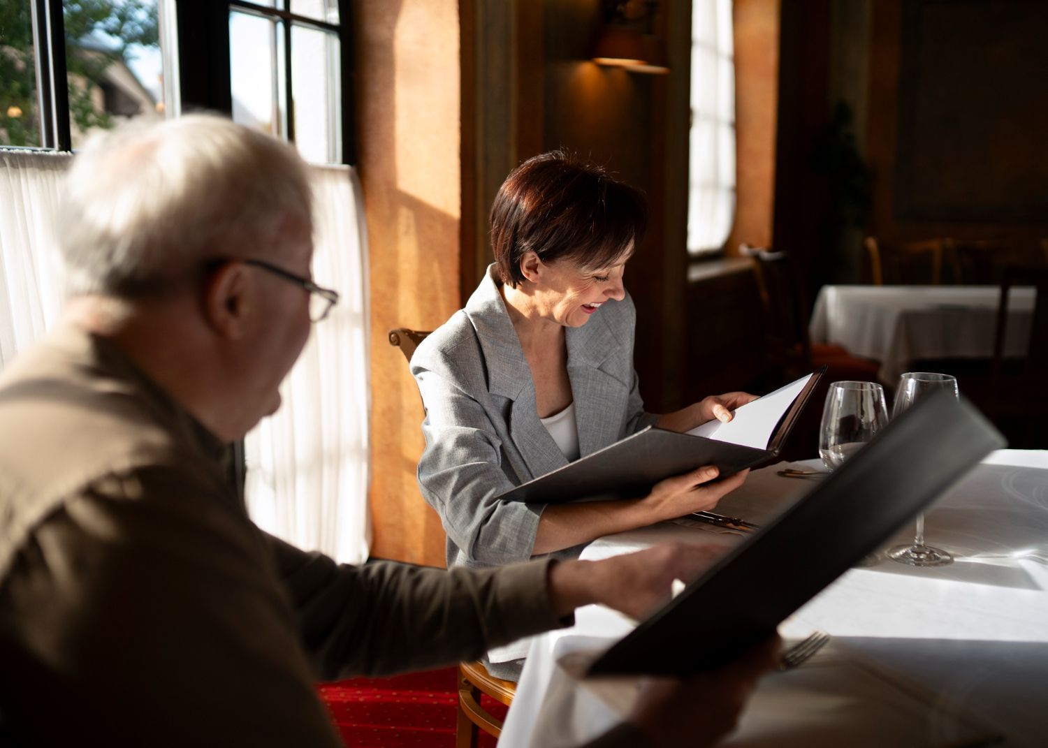 A man and woman are walking down a road with a child.