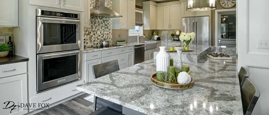 Spacious modern kitchen with island, stainless steel appliances, and granite countertops.