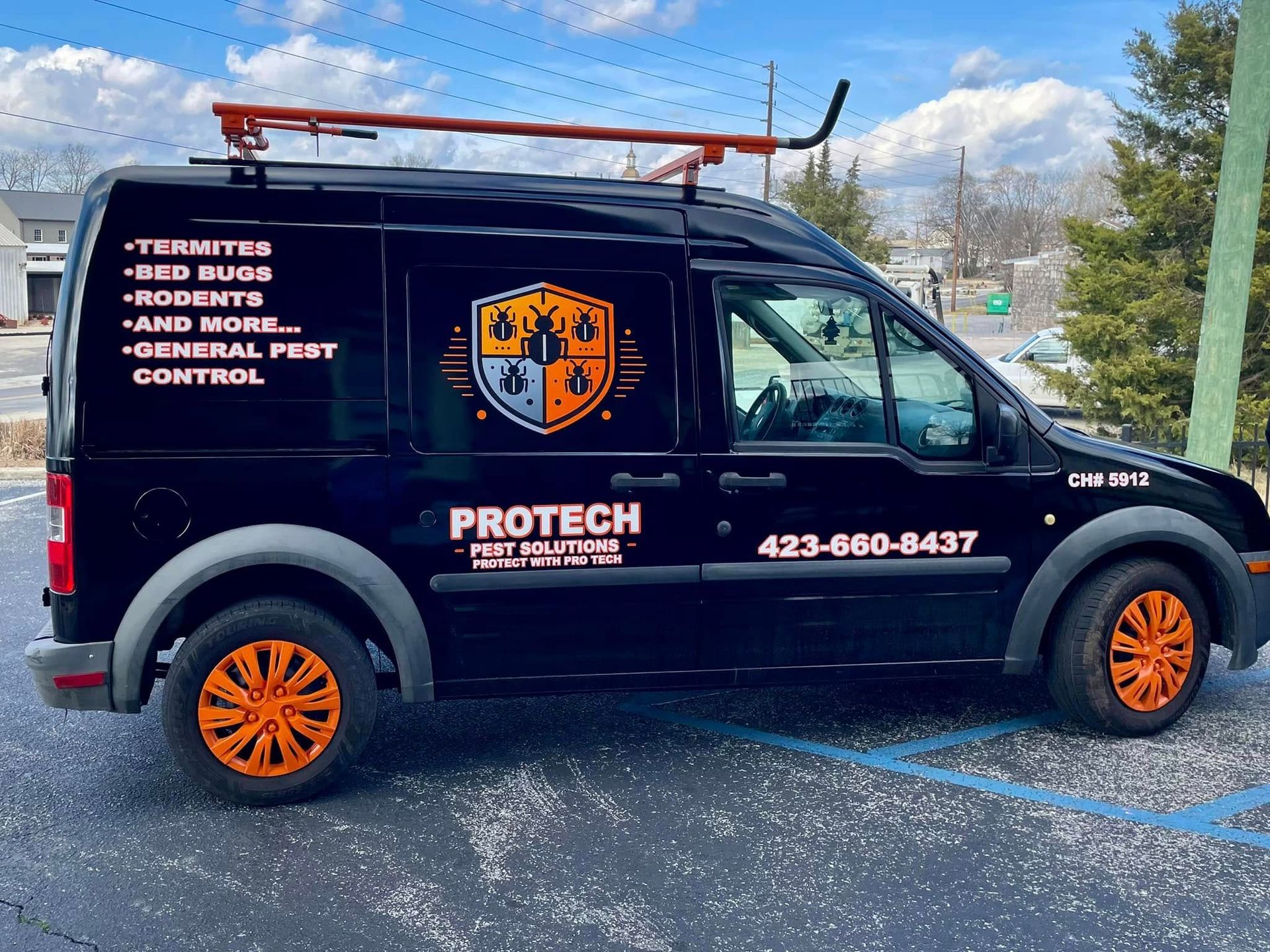 A protech van is parked in a parking lot