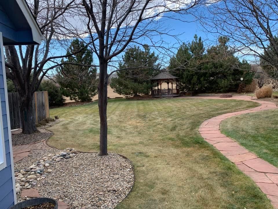 There is a gazebo in the backyard of a house.