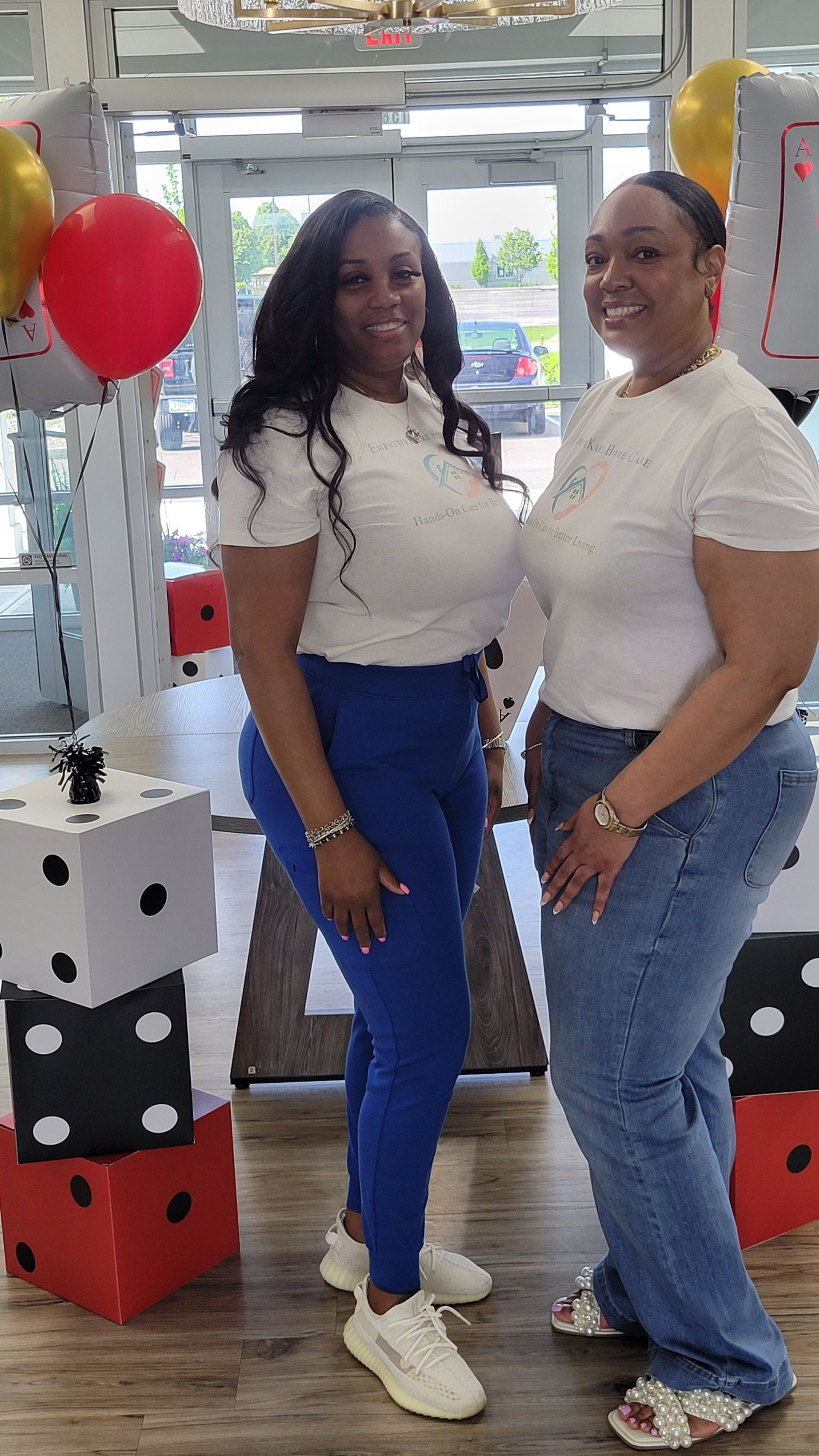 Nurse pushing an elderly person in a wheelchair near a window