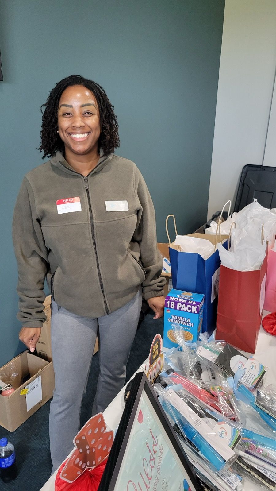 Nurse pushing an elderly person in a wheelchair near a window